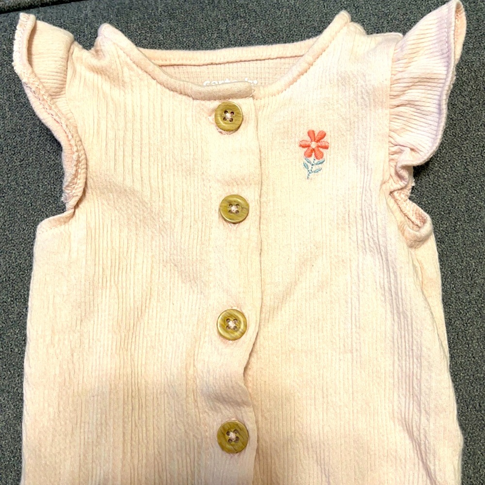 Carter’s newborn size baby girl romper short sleeve with buttons.